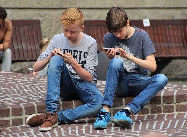 Boys with their cell phone